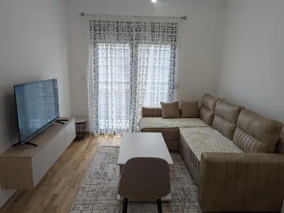 a living room with a couch and a tv at Podgorica Zabjelo titex 3 in Podgorica