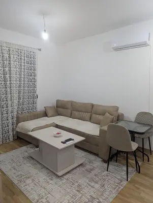 a living room with a couch and a table at Podgorica Zabjelo titex 3 in Podgorica
