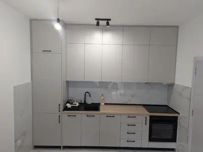 a kitchen with white cabinets and a sink at Podgorica Zabjelo titex 3 in Podgorica