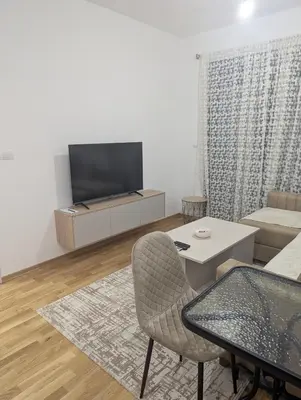 a living room with a tv and a couch at Podgorica Zabjelo titex 3 in Podgorica