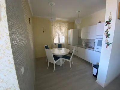 a kitchen and dining room with a table and chairs at Ferienwohnung - Devas in Ulcinj