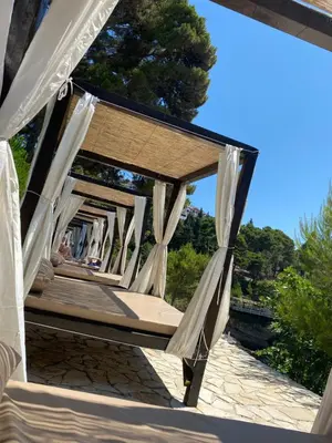 a porch swing with a view of a tree at Ferienwohnung - Devas in Ulcinj