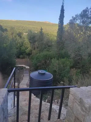 a barrel sitting on a table on a balcony at Apartman sa sopstvenim dvoristem , pored mora in Bigovo
