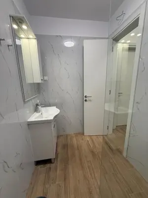 a bathroom with a sink and a shower and a mirror at Apart Hotel Spa Resort Becici, Budva Апартаменты с двумя мастер-спальнями in Becici