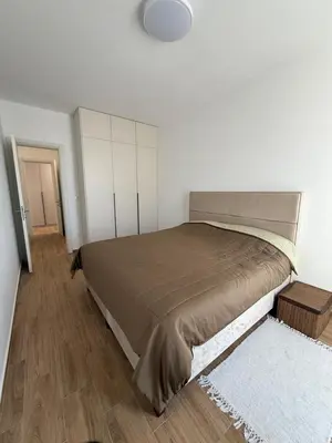 a bedroom with a large bed in a room at Apart Hotel Spa Resort Becici, Budva Апартаменты с двумя мастер-спальнями in Becici