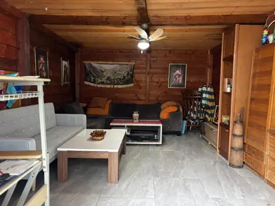 a living room with a couch and a table at Galicia Hill in Boreti
