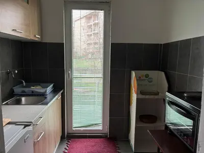 a small kitchen with a sink and a window at Galicia Hills in Becici