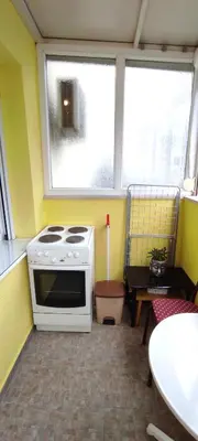 a kitchen with a white stove and a window at Moraca River Residence in Podgorica