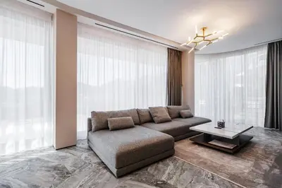 a living room with a couch and a table at Dukley villas in Budva