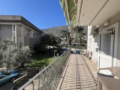 a street with cars parked on the side of a building at Perfect spot Petrovac in Petrovac na Moru