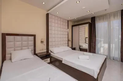 a bedroom with two beds and a window at Deluxe Apartments Shine in Becici