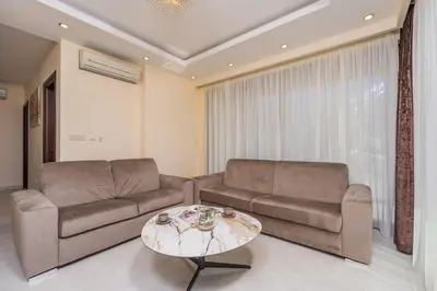 a living room with two couches and a coffee table at Deluxe Apartments Shine in Becici
