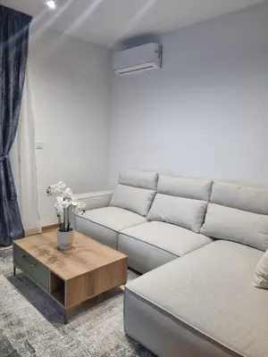 a living room with a couch and a coffee table at Old Town Residence in Podgorica