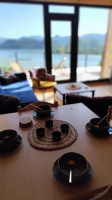 a wooden table with a plate on top of it at Above the Lake in Rogani