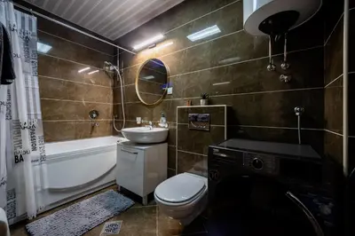 a bathroom with a toilet and a sink and a tub at Sea View Budva in Budva