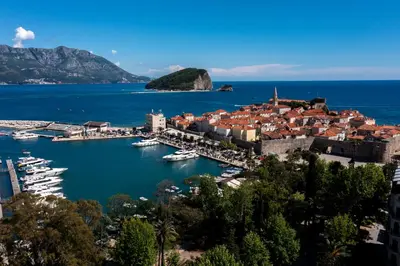 a harbor in a town with boats in the water at Sea View Budva in Budva