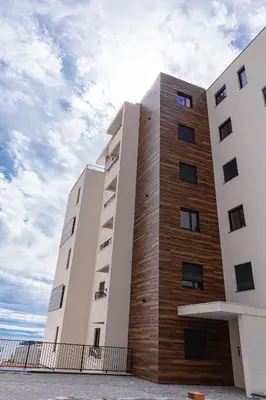 a tall building with a sky in the background at Apartment LEMON in Becici