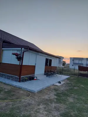 a house with a patio with tables and chairs at Biser Štoja in Donji Štoj
