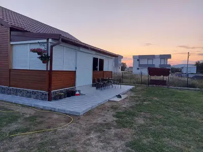 a house with a porch and a patio at Biser Štoja in Donji Štoj