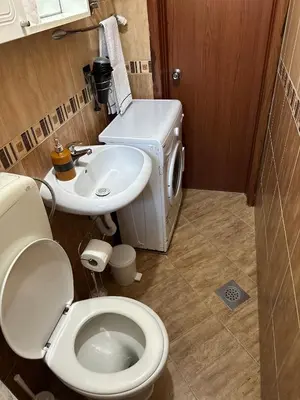 a bathroom with a toilet and a sink at Apartments Tijana in Tivat