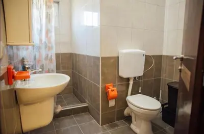 a bathroom with a toilet and a sink at Apartments Tijana in Tivat