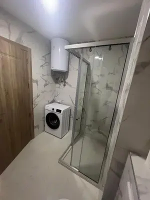 a bathroom with a shower and a toaster at Apartments Bella Notte in Ulcinj