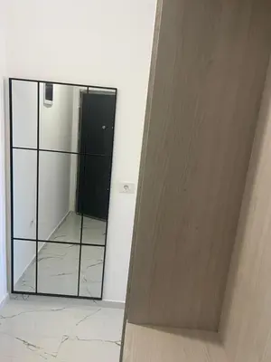 a mirror in the corner of a room at Apartments Bella Notte in Ulcinj