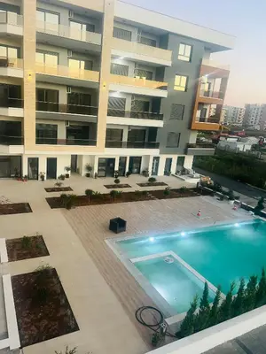 an overhead view of a large apartment building with a swimming pool at Apartments Bella Notte in Ulcinj