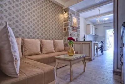 a living room with a couch and a table at Piazza Apartments 2 in Petrovac na Moru