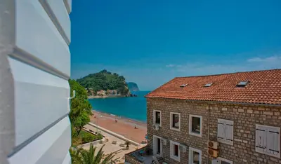 a view of the beach from a building at Piazza Apartments 2 in Petrovac na Moru