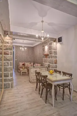 a dining room with a table and chairs at Piazza Apartments 2 in Petrovac na Moru