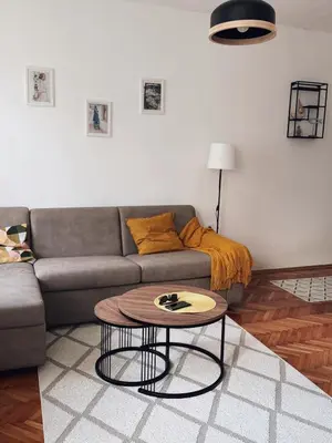 a living room with a couch and a table at Shi Apartment Bar in Bar