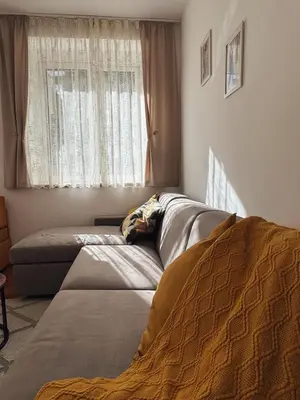 a bedroom with two beds and a window at Shi Apartment Bar in Bar