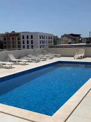 a swimming pool on the roof of a building at Stan 15 in Dobra Voda