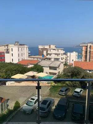 a group of cars parked in a parking lot at Stan 15 in Dobra Voda