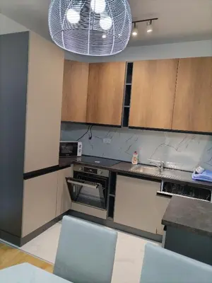 a kitchen with a sink and a stove top oven at Mountain view in Budva