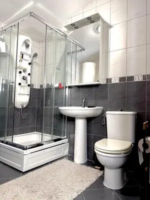 a bathroom with a toilet and a sink and a shower at Adriatic Home in Pržno