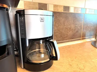 a coffeemaker sitting on top of a counter at Adriatic Home in Pržno
