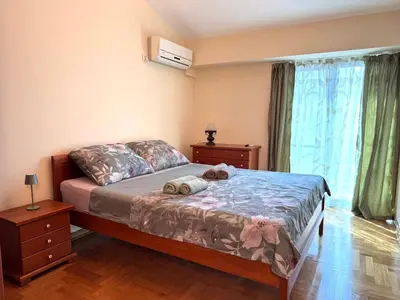 a bedroom with a bed with two towels on it at Adriatic Home in Pržno