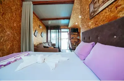 a bedroom with a bed with a bow tie on it at Vuk - Ada Bojana in Ulcinj