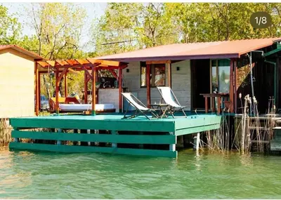 a house on a dock in the water at Vuk - Ada Bojana in Ulcinj