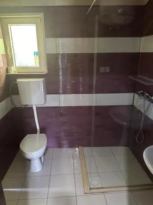 a bathroom with a toilet and a sink at Vuk - Ada Bojana in Ulcinj