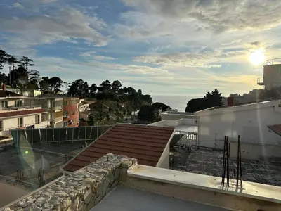 a view from the roof of a building with the ocean at Datek's Apartments in Ulcinj