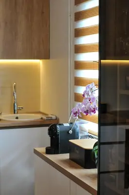 a kitchen with a counter with a bag and a sink at Moderan dvosoban stan in Budva