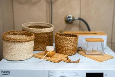 a counter with baskets and a stool on it at Handmade house Rijeka Crnojevica in Donje Selo