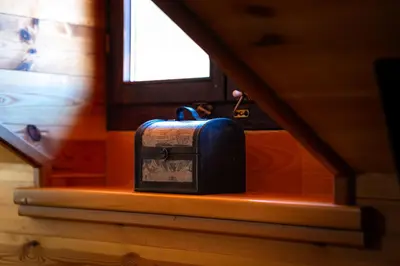 a briefcase sitting on a shelf under a window at Handmade house Rijeka Crnojevica in Donje Selo