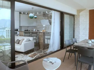 a living room with a white couch and a table at Apartments Alacritas in Budva