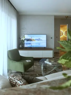 a living room with a flat screen tv on a wall at Apartments Alacritas in Budva