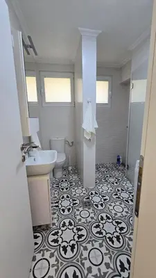 a bathroom with a sink and a toilet at Luxury Suite in Kotor