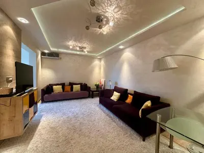 a living room with two couches and a tv at Apartment Relax Petrovac in Petrovac na Moru